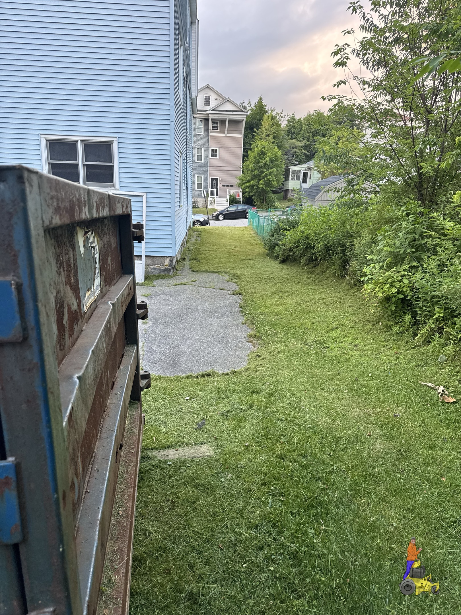 Clean-cut side yard in Worcester after Nice Lawn Bro mowing service
